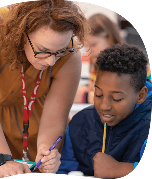 A Summit teacher working with a student one-on-one